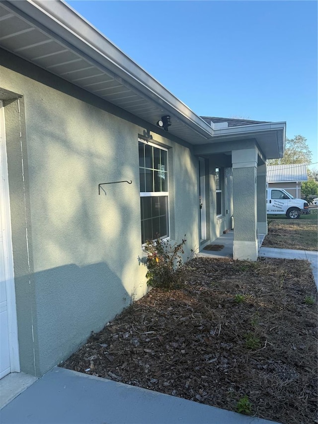 view of side of home featuring stucco siding