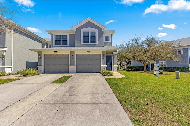 traditional-style home featuring a garage, stucco siding, driveway, and a front lawn