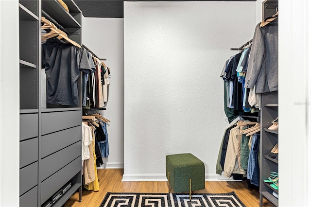 spacious closet with wood finished floors