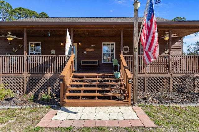 property entrance with a porch, ceiling fan, and roof with shingles