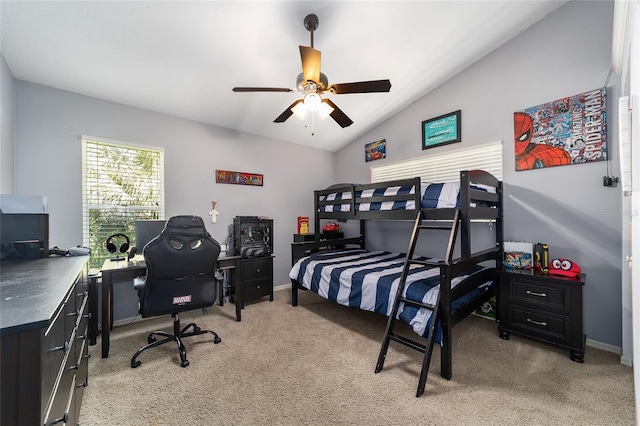 bedroom featuring lofted ceiling, a ceiling fan, baseboards, and light carpet