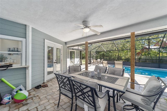 sunroom with a wealth of natural light and ceiling fan