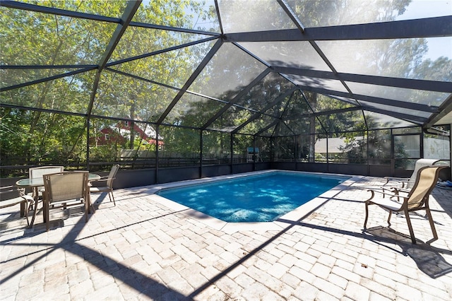 pool featuring outdoor dining area, a lanai, and a patio area