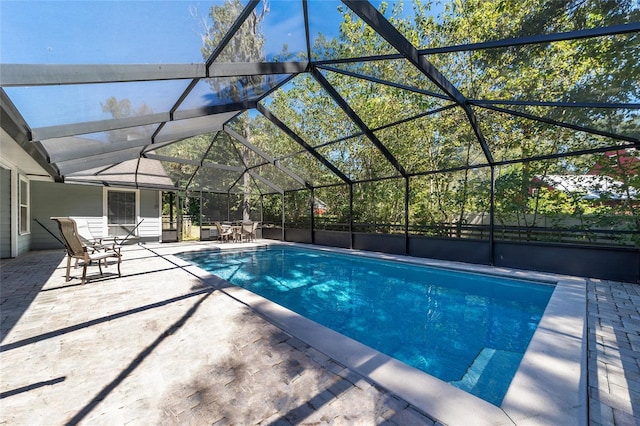 pool with a patio and a lanai