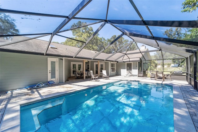 pool featuring french doors, a patio, and a lanai