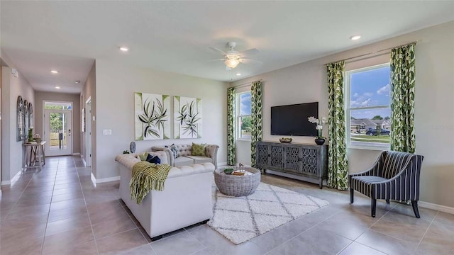 tiled living area with recessed lighting, baseboards, and ceiling fan