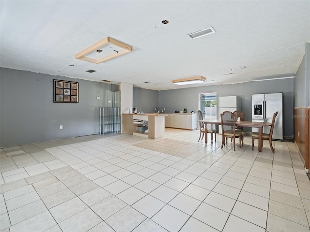 interior space with visible vents and light tile patterned flooring