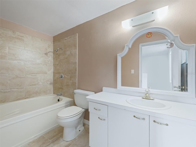 bathroom featuring tile patterned floors, bathing tub / shower combination, toilet, and vanity