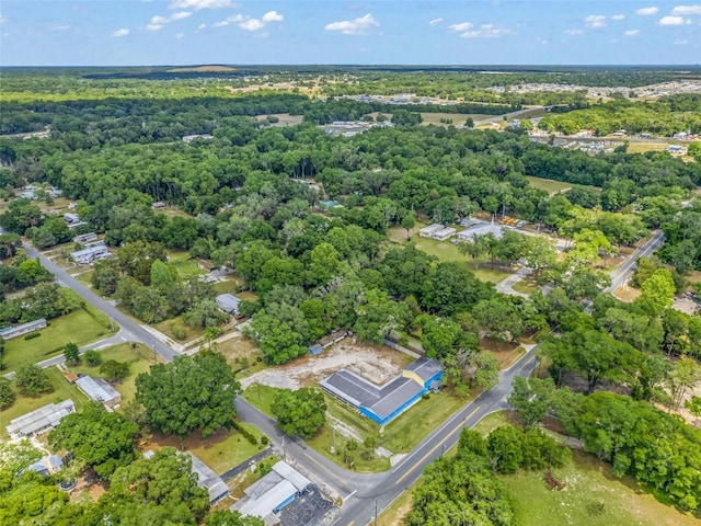 drone / aerial view featuring a view of trees