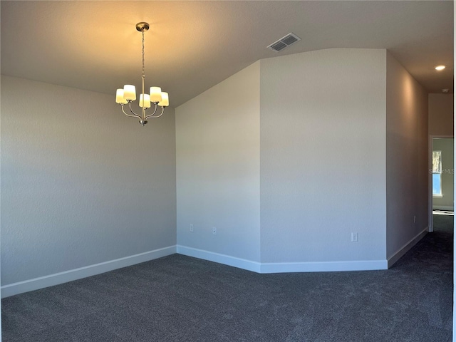 spare room with visible vents, dark carpet, baseboards, and an inviting chandelier