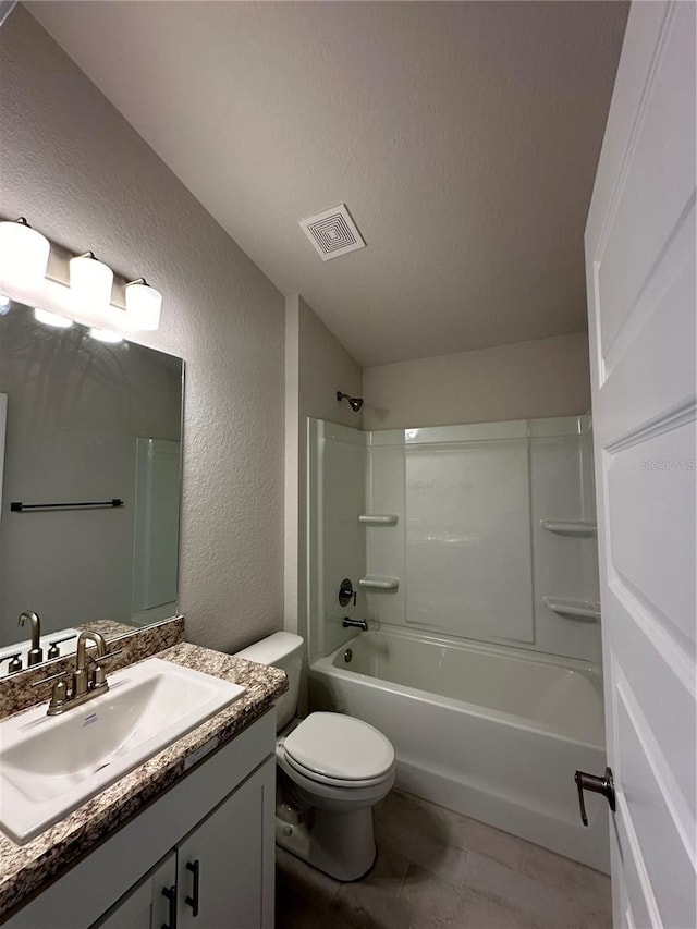 full bath featuring vanity, a textured ceiling, visible vents, shower / bath combination, and a textured wall