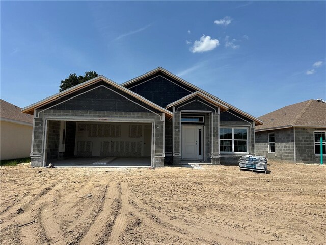 4413 SW 90th Pl, Ocala, FL 34476 - view of front of home with dirt driveway and an attached garage