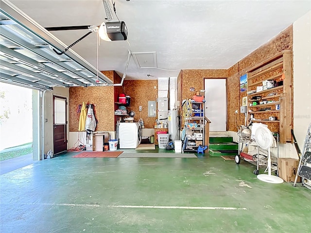 garage featuring electric panel and a garage door opener