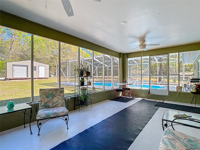 sunroom / solarium with a ceiling fan