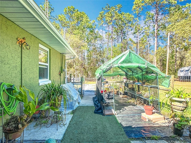 view of yard featuring a patio and fence