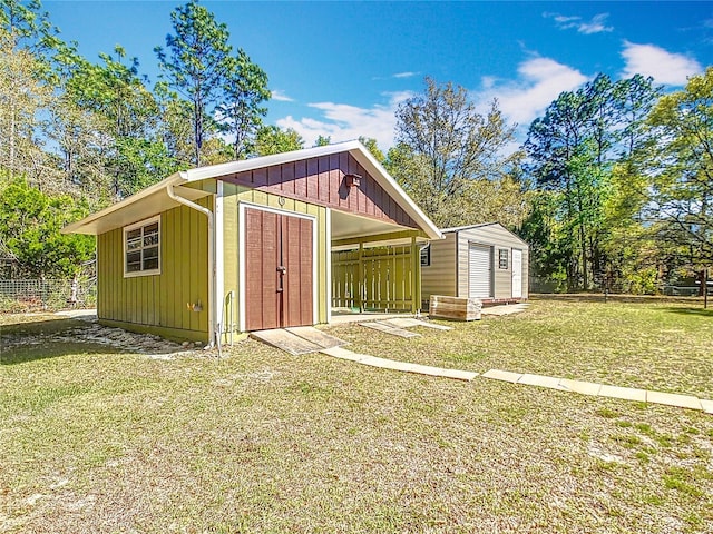 view of shed featuring fence