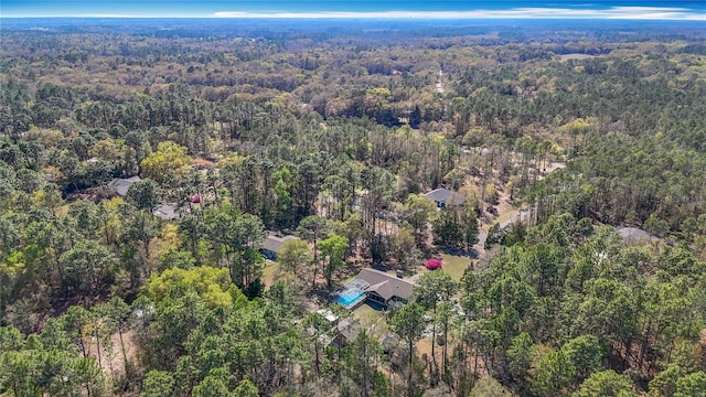 aerial view featuring a forest view