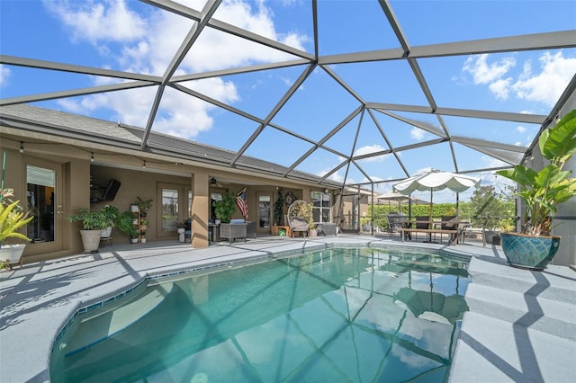 pool featuring a lanai and a patio