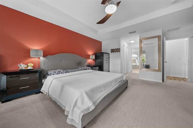 bedroom featuring ceiling fan, baseboards, visible vents, and light carpet