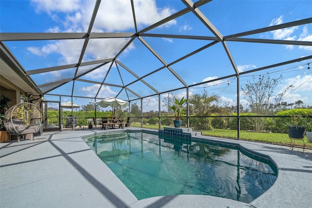 pool with glass enclosure and a patio