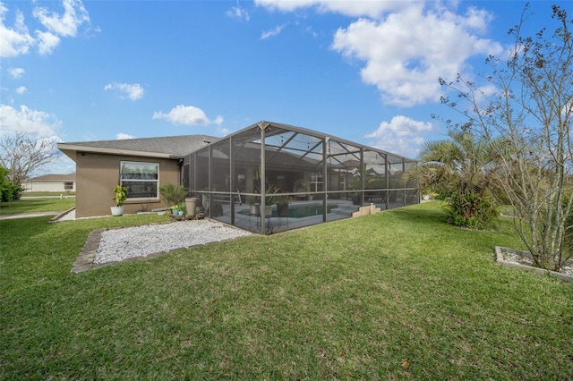 view of yard featuring glass enclosure, a patio area, and an outdoor pool