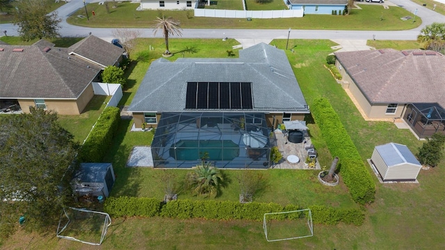 birds eye view of property with a residential view