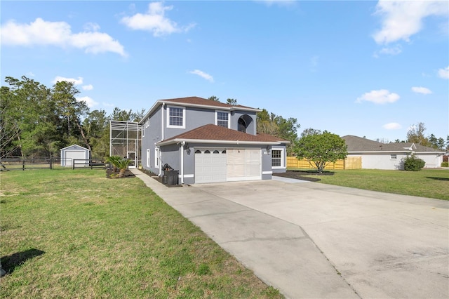 traditional-style home with fence, concrete driveway, a front yard, stucco siding, and a garage