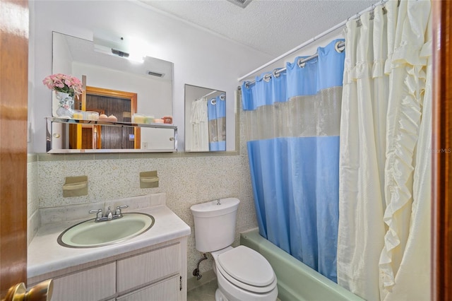 bathroom featuring backsplash, shower / bath combo with shower curtain, toilet, vanity, and a textured ceiling