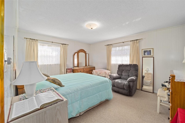 carpeted bedroom featuring a textured ceiling