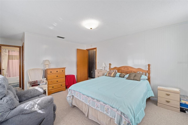 carpeted bedroom featuring visible vents