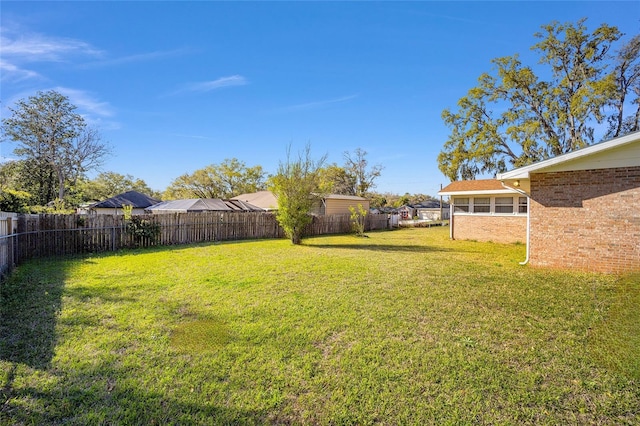 view of yard featuring a fenced backyard