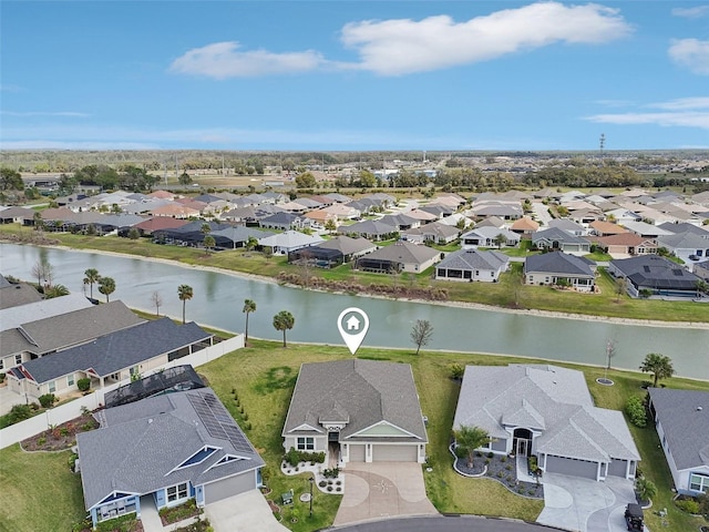 bird's eye view featuring a residential view and a water view