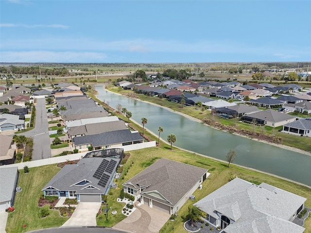 aerial view with a residential view and a water view