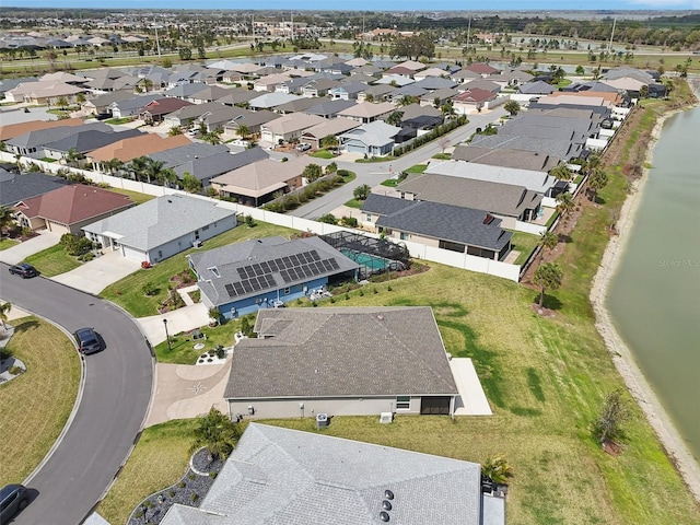 birds eye view of property with a residential view and a water view