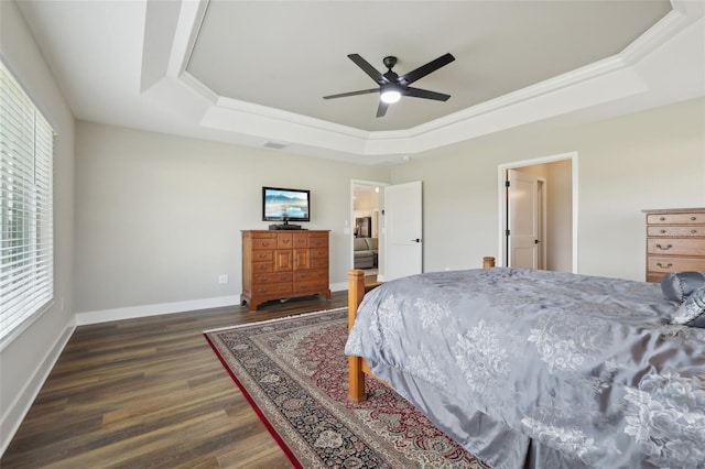 bedroom with visible vents, a raised ceiling, dark wood-type flooring, baseboards, and ceiling fan