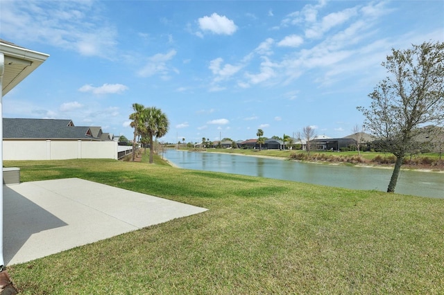 view of yard featuring a water view and a patio area