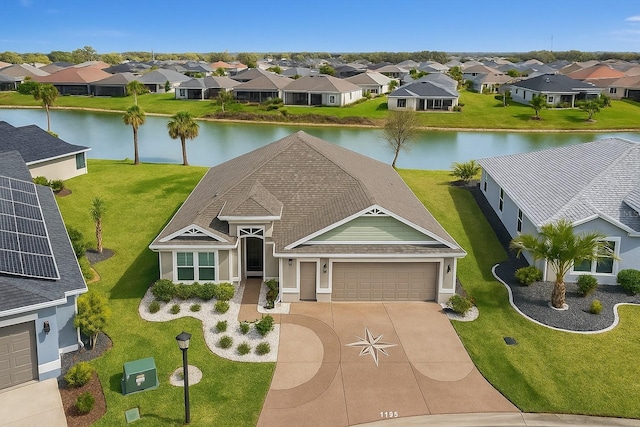 5766 Henry Loop, The Villages, FL 32163 - view of front of house with a residential view, a garage, driveway, and a water view