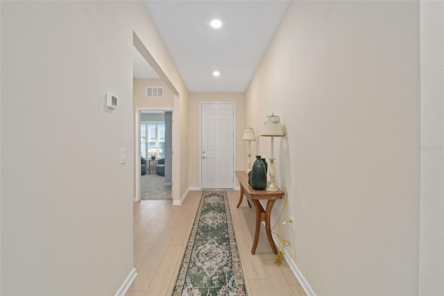 entryway featuring recessed lighting, visible vents, baseboards, and light wood finished floors