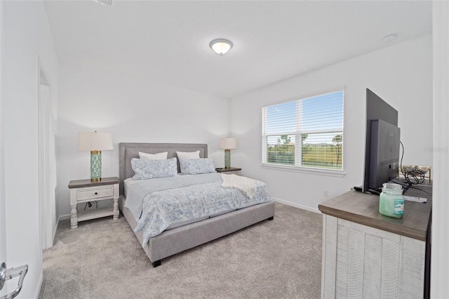 bedroom with carpet and baseboards