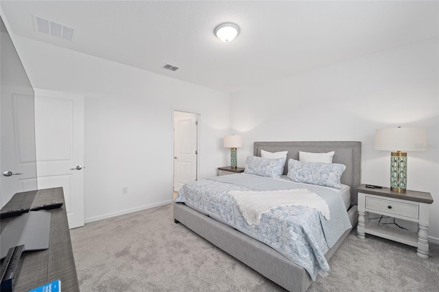 bedroom featuring baseboards, visible vents, and carpet floors