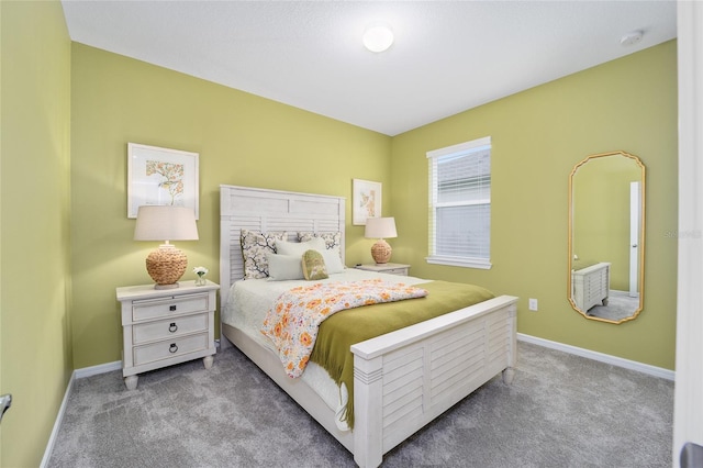 bedroom featuring baseboards and carpet flooring