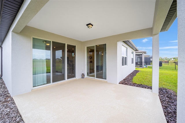 view of patio / terrace featuring fence