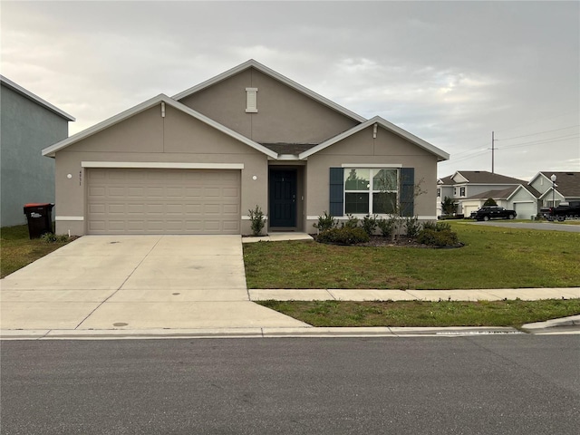 view of front facade featuring a garage, stucco siding, concrete driveway, and a front lawn