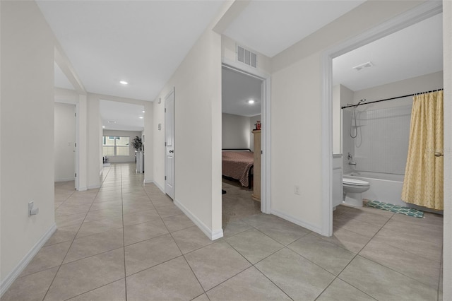 4931 SW 88th Pl, Ocala, FL 34476 - hallway featuring light tile patterned floors, visible vents, and baseboards
