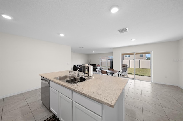 4931 SW 88th Pl, Ocala, FL 34476 - kitchen featuring visible vents, dishwasher, light tile patterned floors, white cabinetry, and a sink