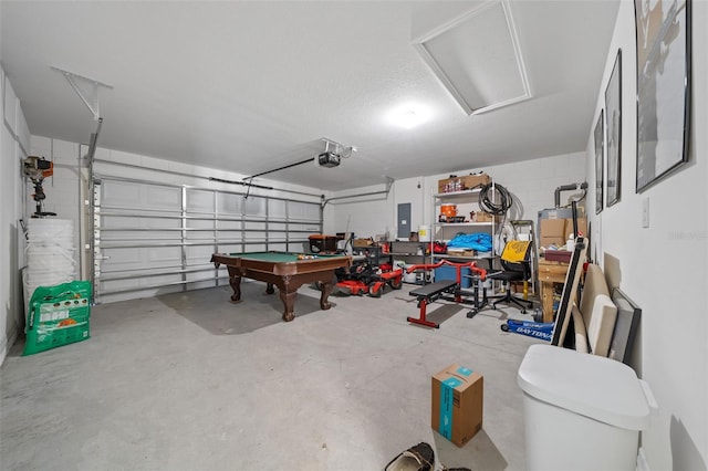 4931 SW 88th Pl, Ocala, FL 34476 - garage with electric panel, a garage door opener, and concrete block wall