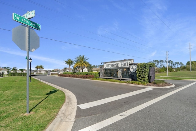 4931 SW 88th Pl, Ocala, FL 34476 - view of street featuring a gated entry and curbs