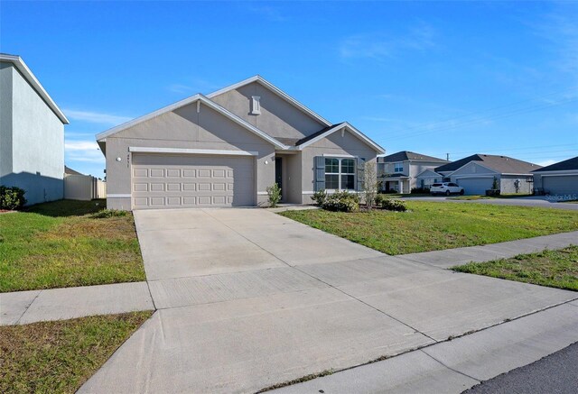 4931 SW 88th Pl, Ocala, FL 34476 - ranch-style house with a front yard, an attached garage, driveway, and stucco siding