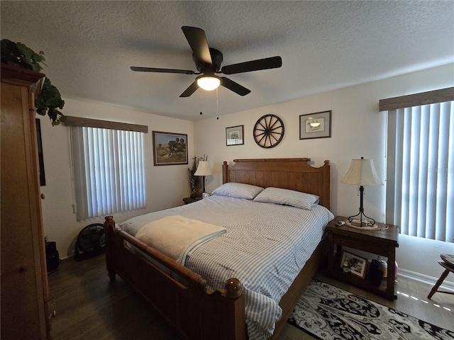 bedroom with a textured ceiling, ceiling fan, and wood finished floors