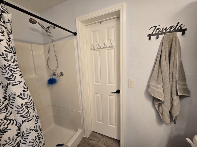 bathroom with a shower stall